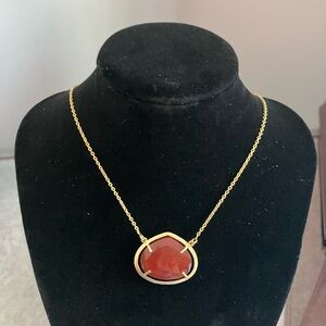 Elegant Gold Necklace with Red Pendant